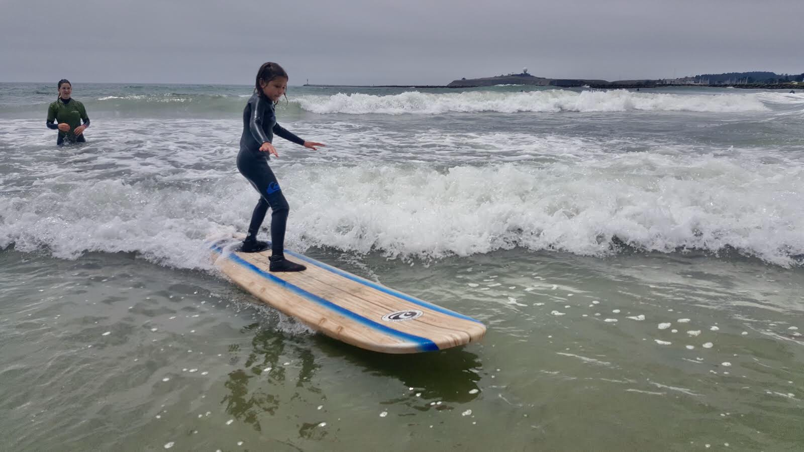 STUDENT ON SURF BOARD FROM Private Surfing Lesson